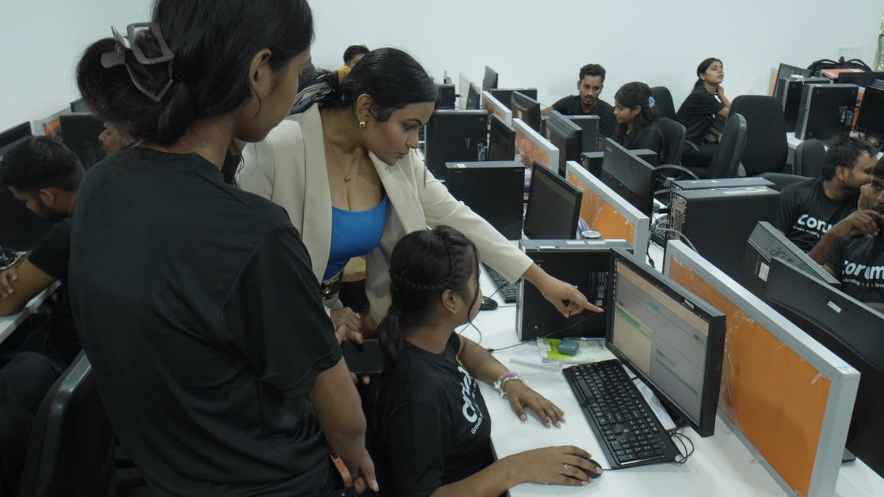 The Corum8 team working in the office