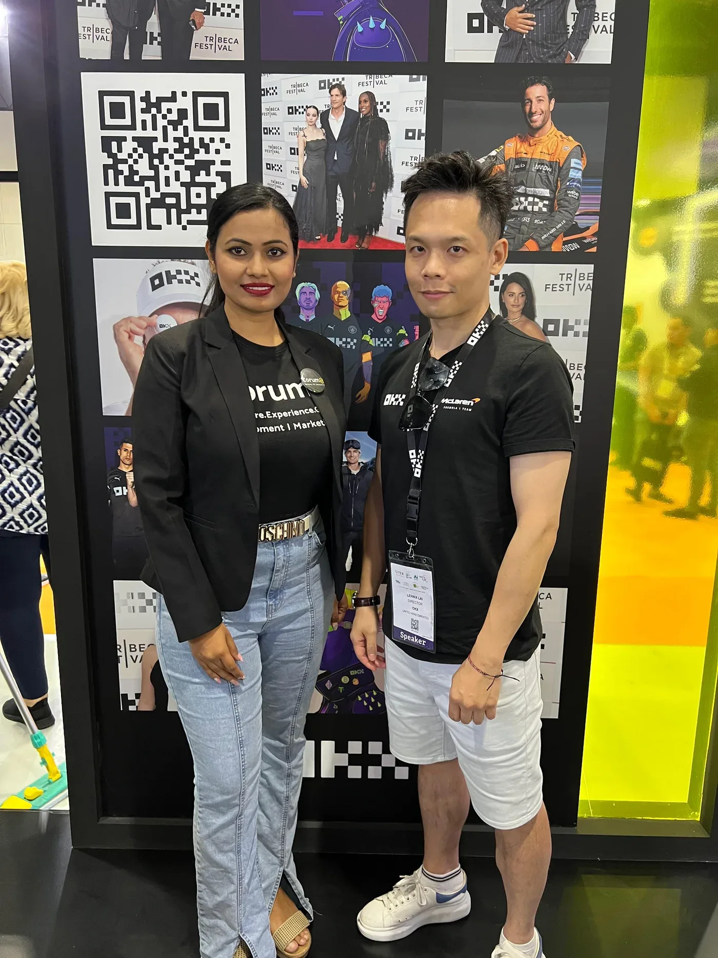 Corum8 team with a client at their conference booth