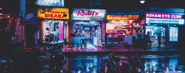 Illuminated advertising signage on a street