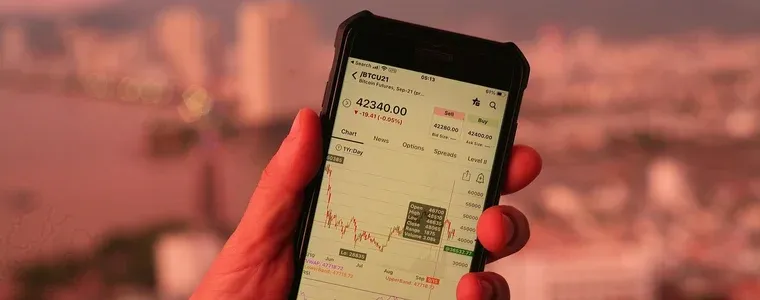 A crypto trading app open on a phone