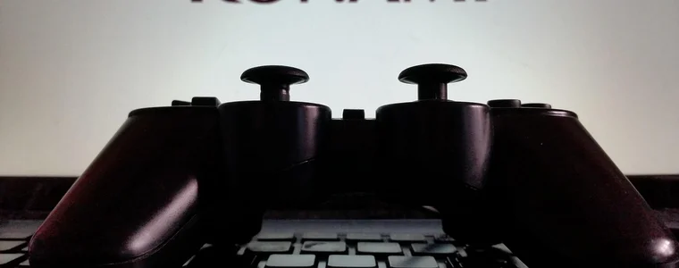 A game controller lit by the screen in front of it
