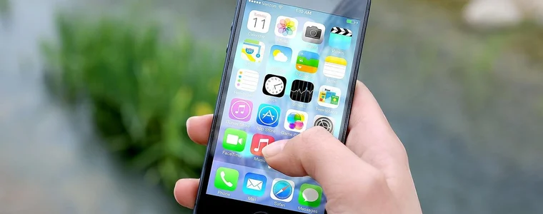 An app open on a phone held in one hand