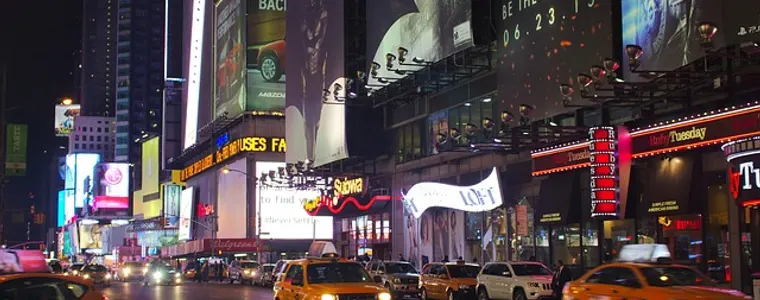 Billboards lighting a city intersection at night